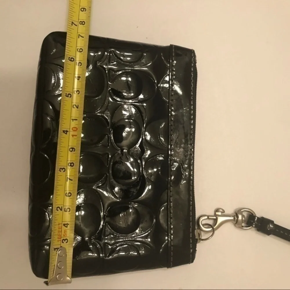 Coach black patent leather embossed c wristlet bag